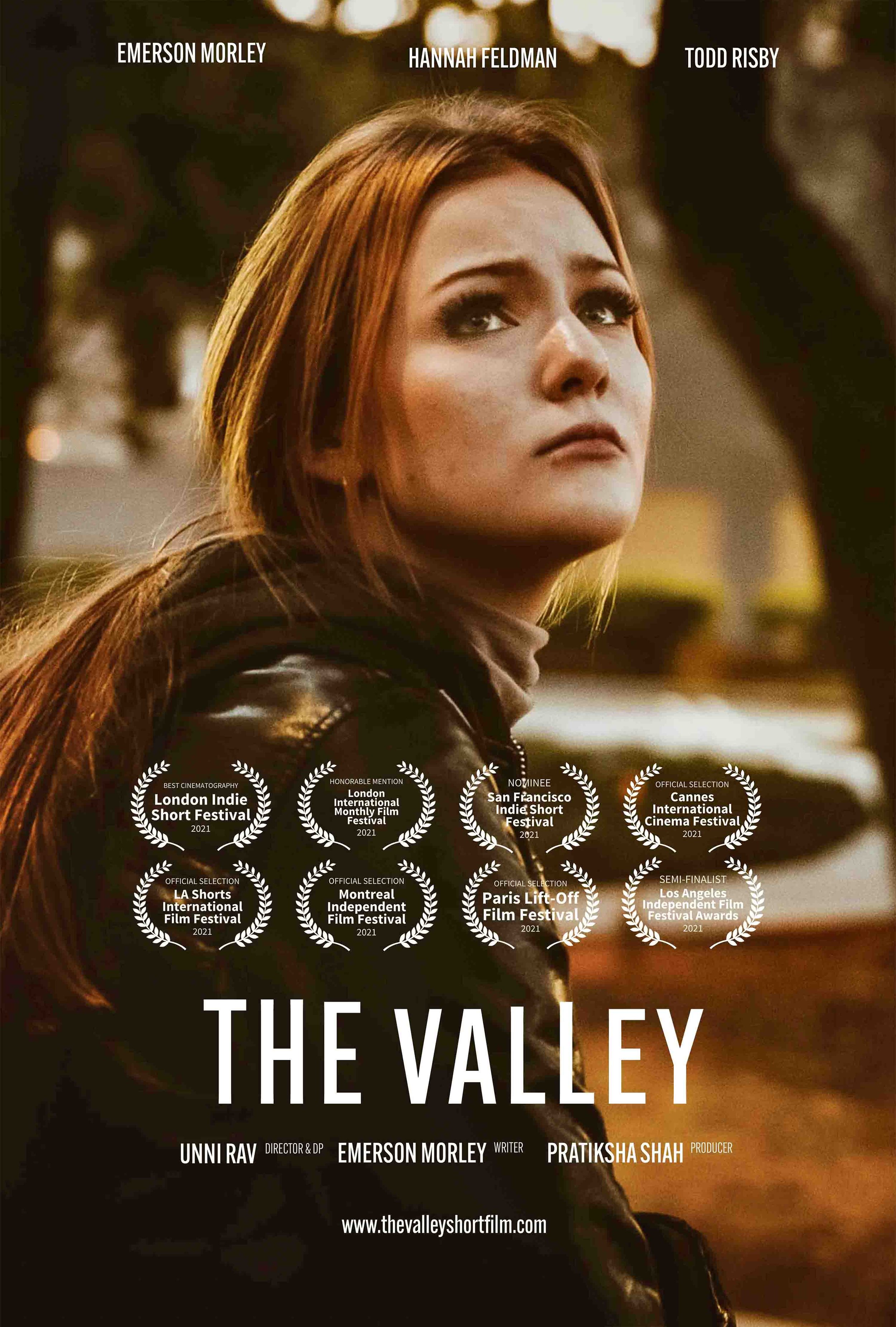 A promotional poster for the film "The Valley," featuring a woman with red hair looking upward, with accolades from various film festivals displayed, including London Indie Short Festival 2021, San Francisco Indie Short Festival 2021, Los Angeles Indie Short International Film Festival 2021, and more.