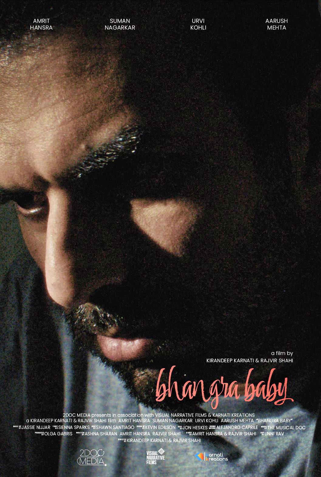 Close-up of a man's face with dark skin and a beard, partially shadowed, on the movie poster titled 'Bhangra Baby' with text listing actors and film credits.