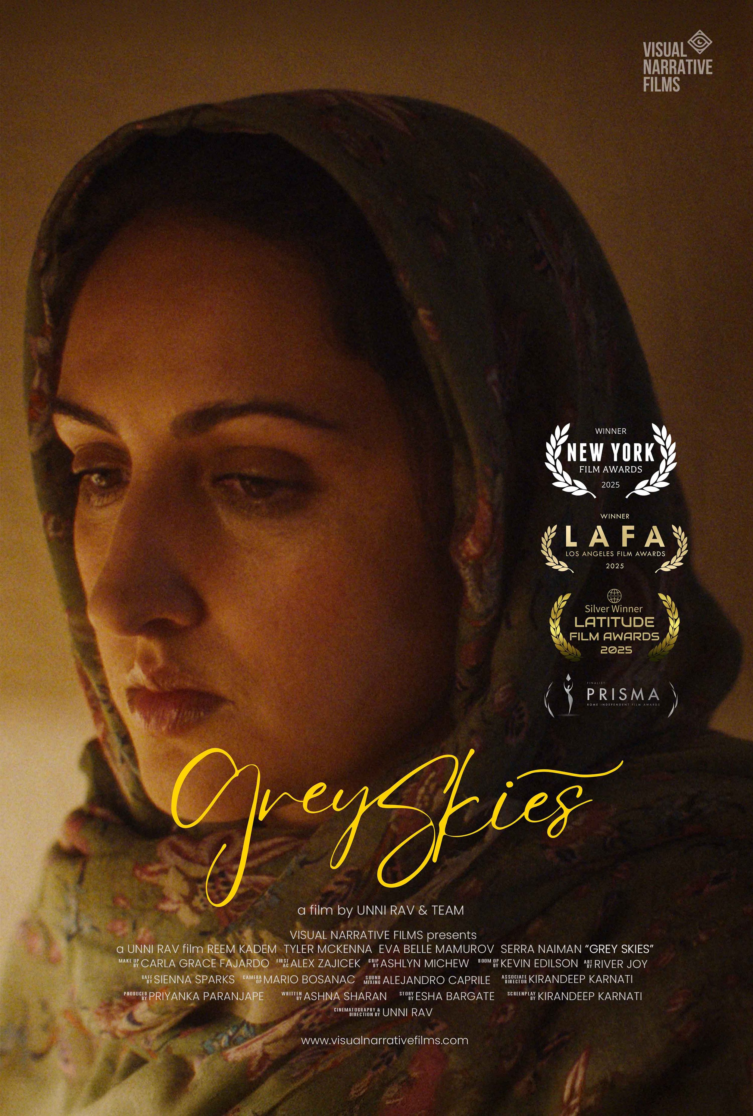 Close-up of a woman's face with a patterned headscarf, looking down or away, with awards and movie title 'Grey Skies' overlayed.